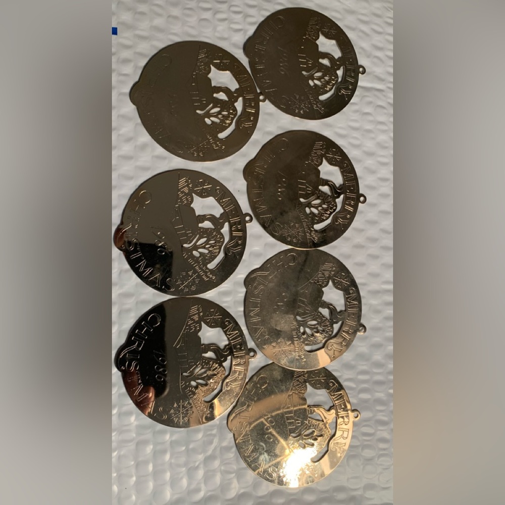 Set of seven metal gold tone 1986 Merry  Christmas ornaments Vintage estate